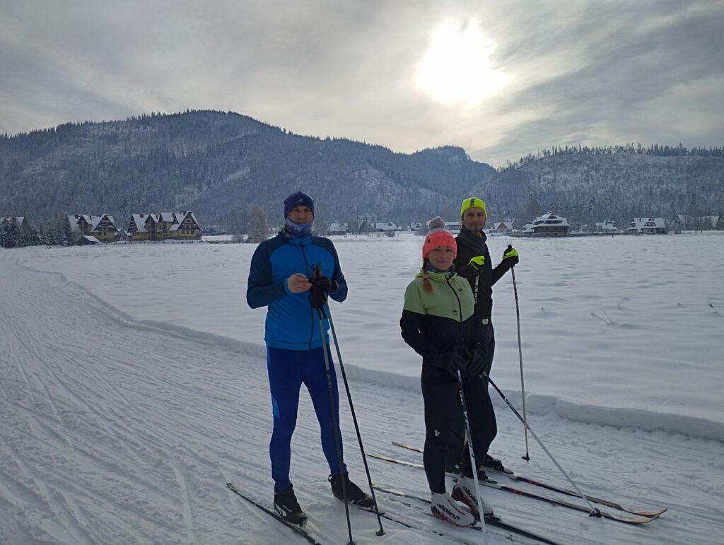 May be an image of 2 people and people skiing